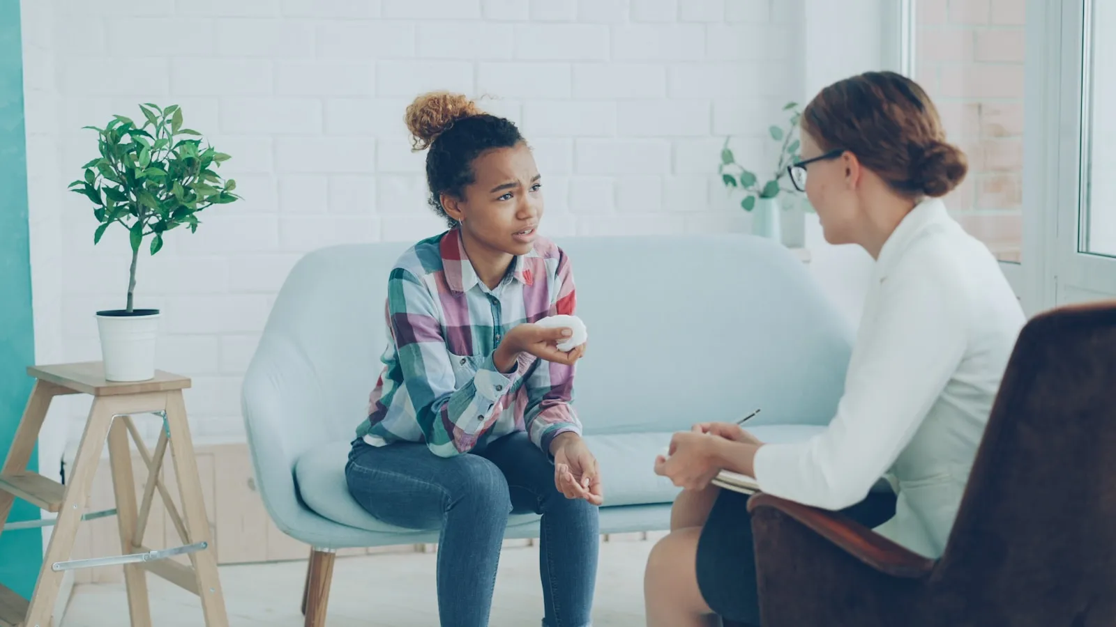 A therapist listening during a counseling conversation